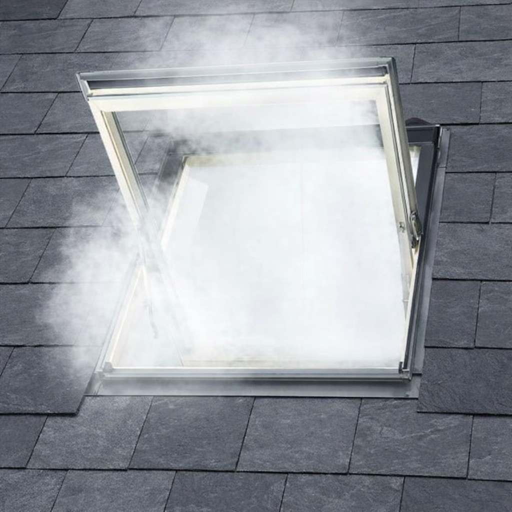 Smoke ventilation roof window open in a slate roof