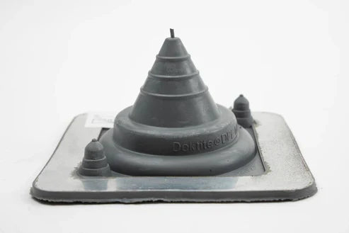 Grey rubber pipe flashing on a white background