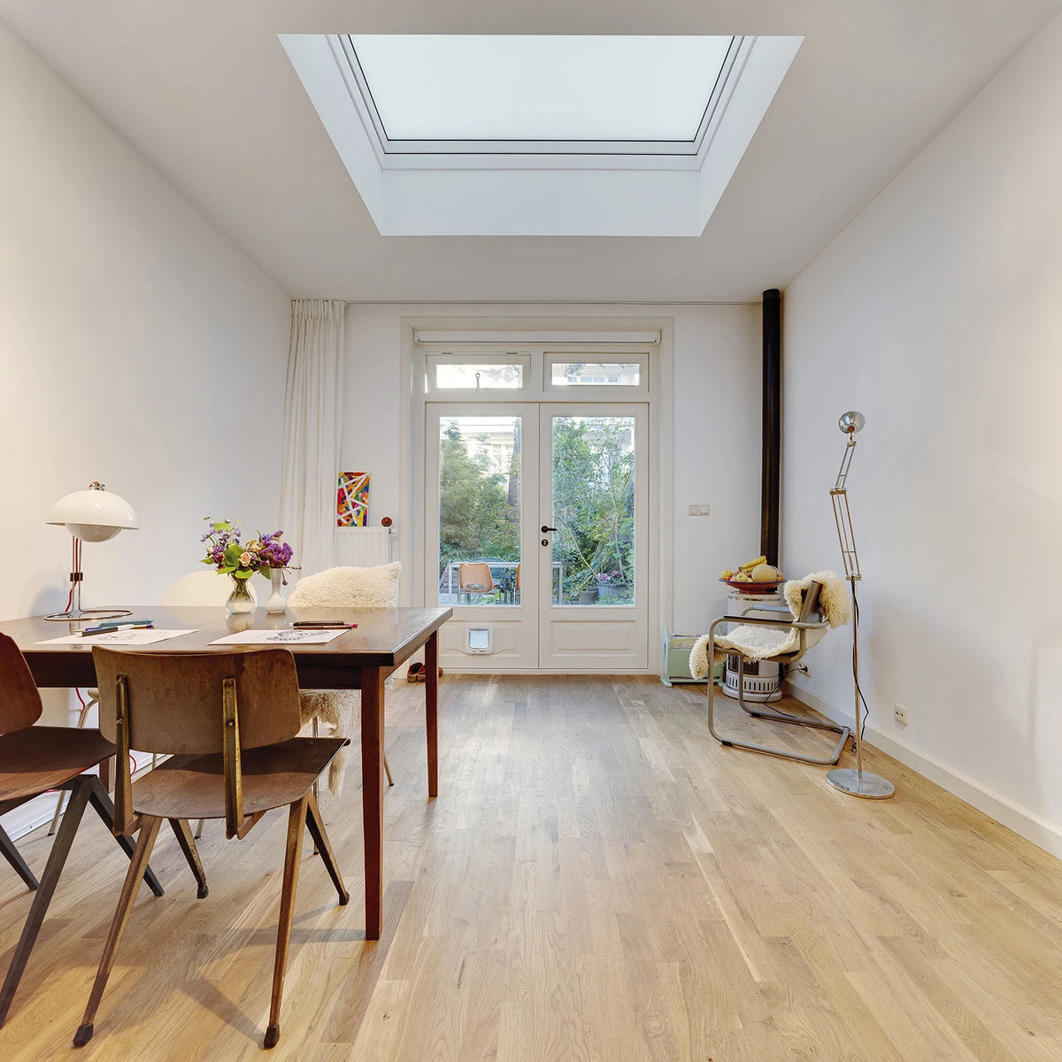FAKRO DXC-C P2 non-opening flat roof dome - in a dining room