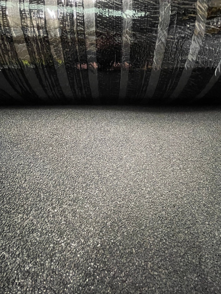 Close-up of StrataBit Rapid-O single layer roofing membrane roll partially unrolled highlighting surface texture