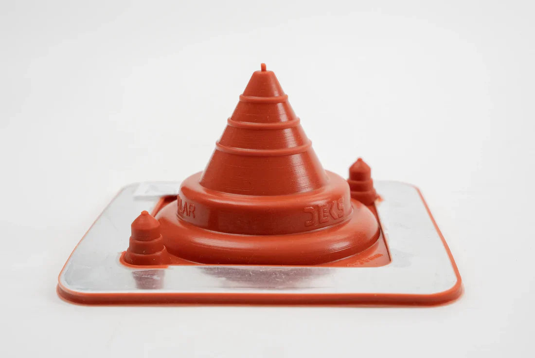 Red plastic funnel-shaped object on a white background