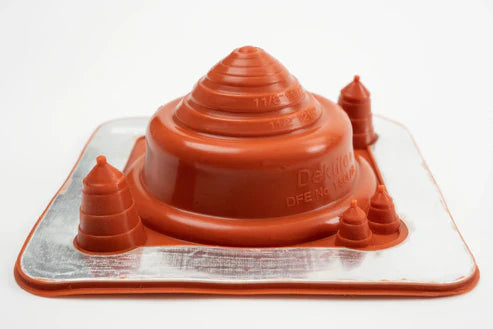 Red silicone pipe flashing with multiple levels on a white background