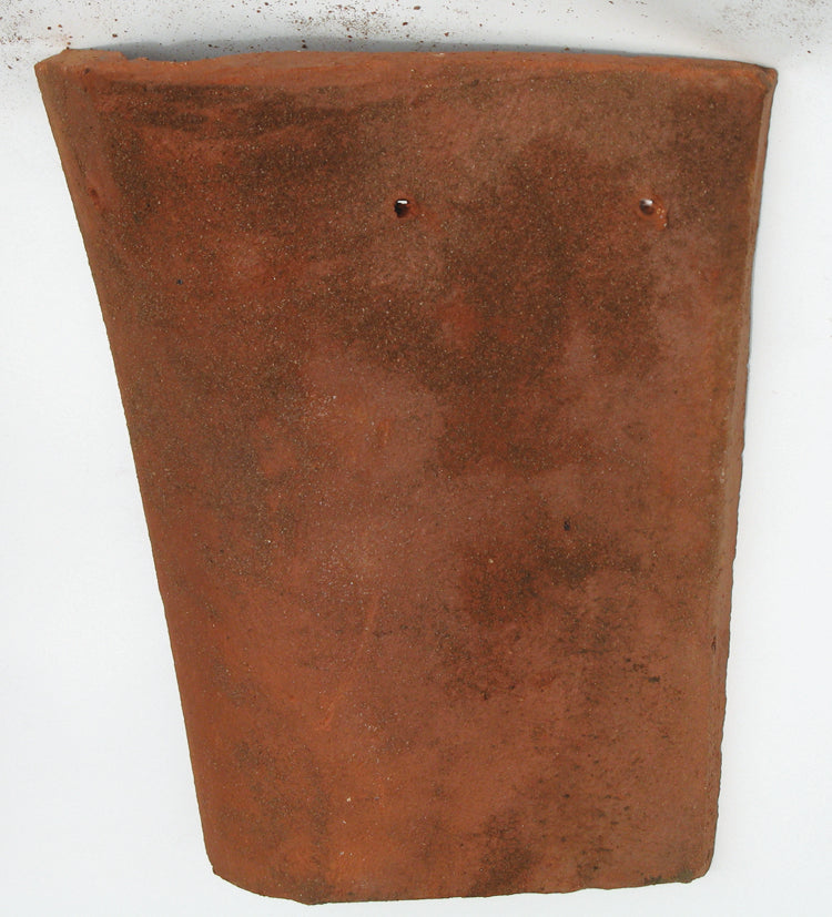 Clay internal angle roof tile designed to create a neat 90-degree internal junction where roof slopes meet.

