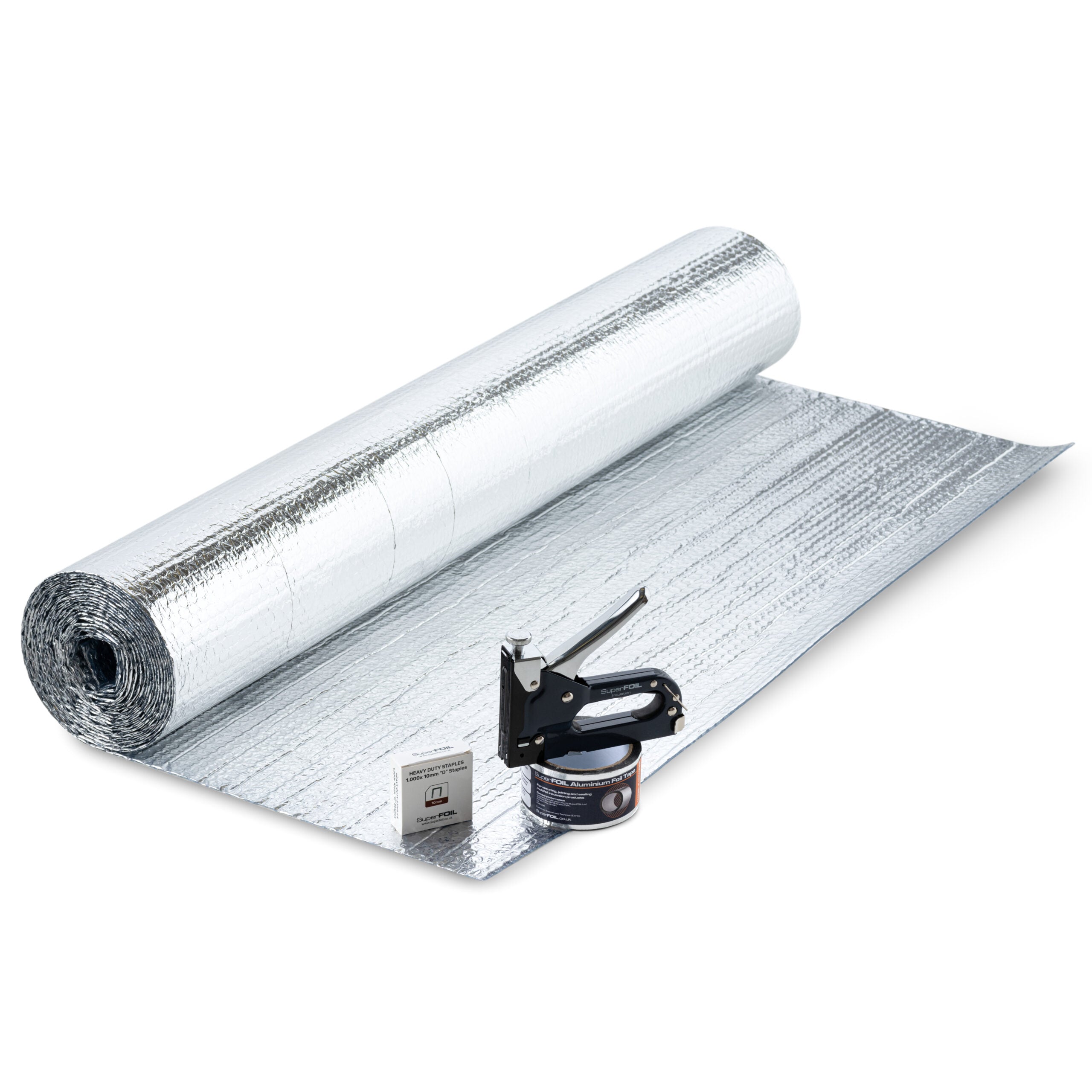 SuperFOIL shed insulation kit with reflective foil roll, staple gun, foil tape and staples laid out on insulation sheet