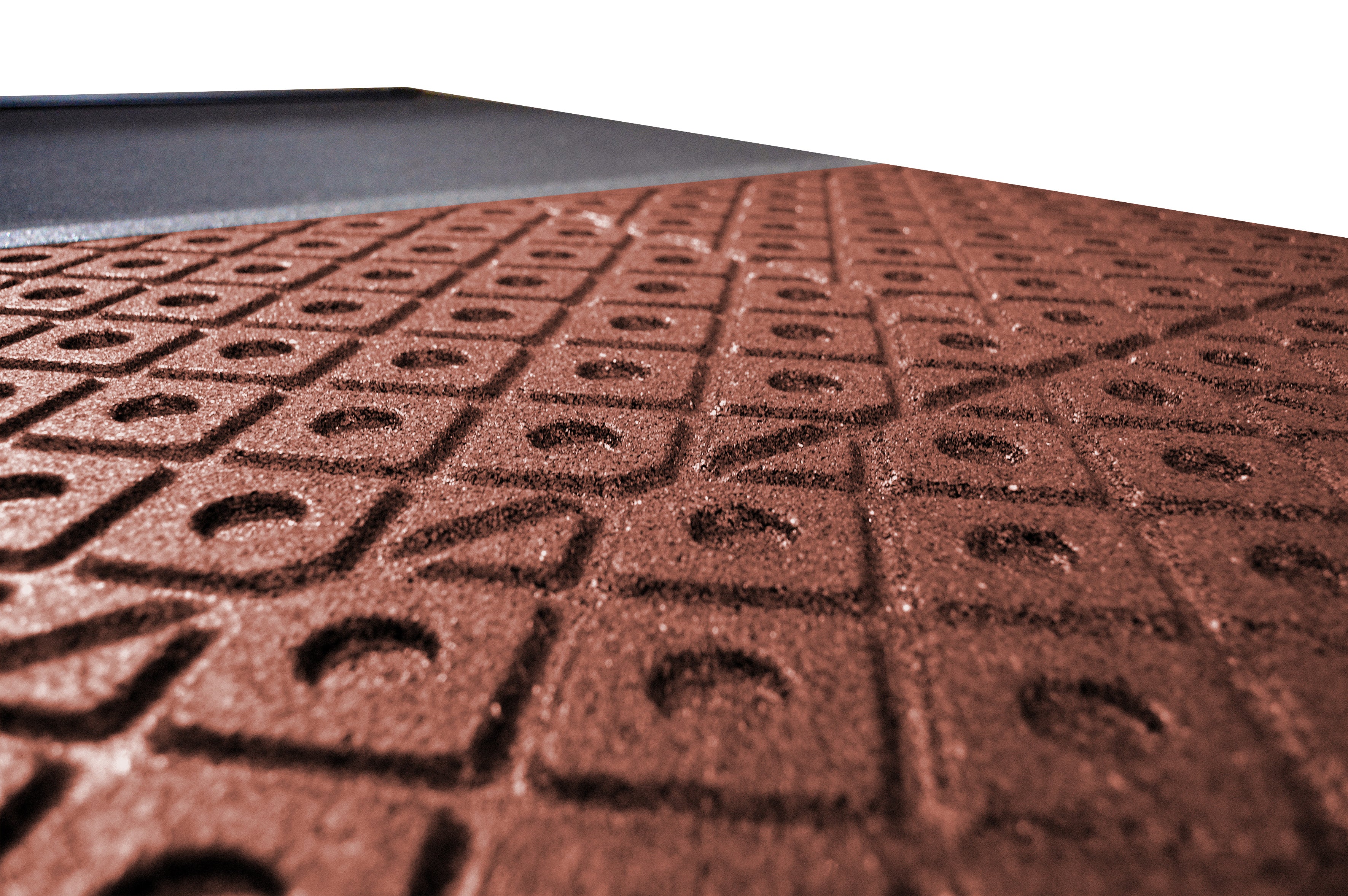 Close-up of red ecotred 500 tile's recessed moisture grooves.